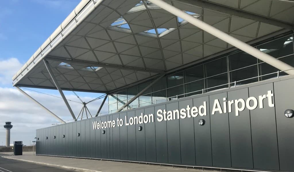 London Stansted Airport terminal with Welcome to London Stansted Airport signage