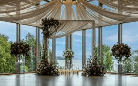 Wedding ceremony venue overlooking Loch Lomond with floral décor and lake views