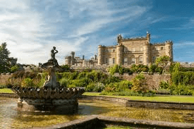 Historic Scottish castle estate with fountain and formal gardens in the Highlands