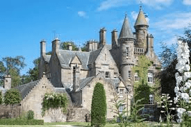Historic Scottish baronial manor house with turrets and gardens near St Andrews